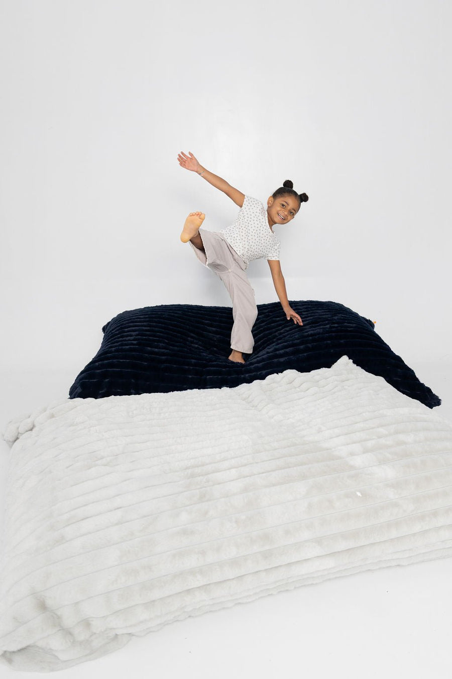 A girl jumping between two Baggies