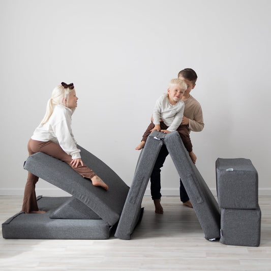 Charcoal Figgy play couch styled in a modern kid-friendly living room