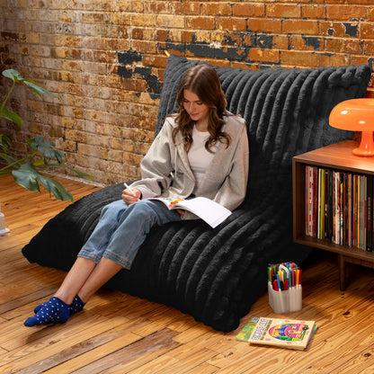 Shadow Baggy propped against a wall as a reading chair