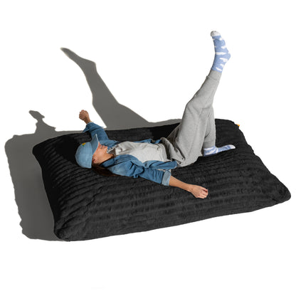The Shadow Baggy shown flat with a person lying across it, for scale