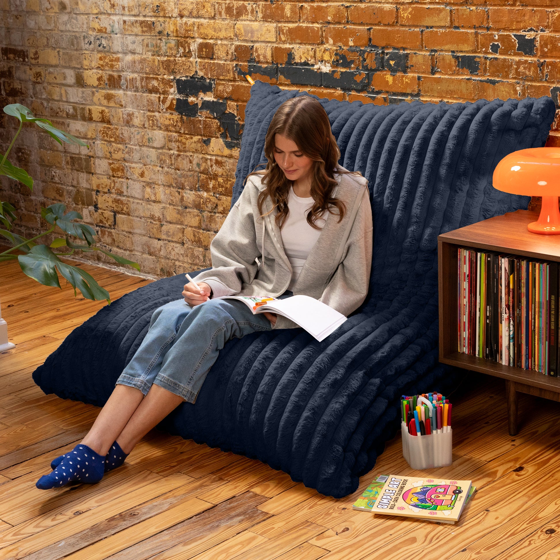 Night Owl Baggy propped against a wall as a reading chair