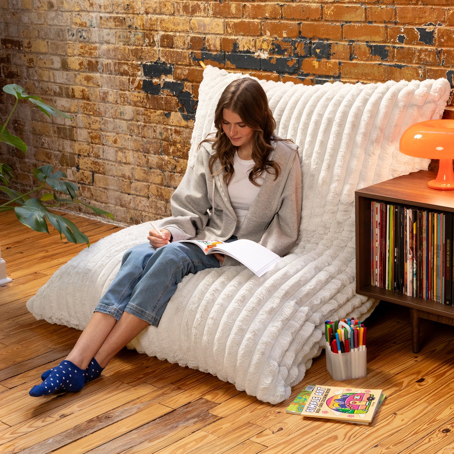 Snow Baggy propped against a wall as a reading chair