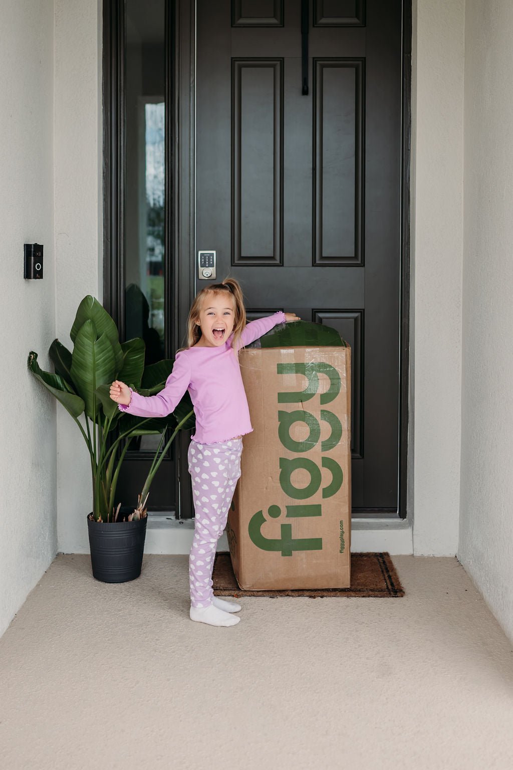 Excited child with Figgy delivery box
