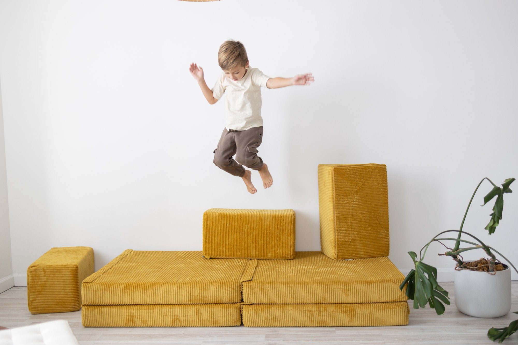 Child playing on Figgy modular play couch